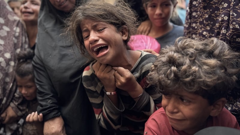Relatives of those killed in Israeli attacks on different parts of the Khan Younis mourn as the dead bodies are taken from the Nasser Hospital