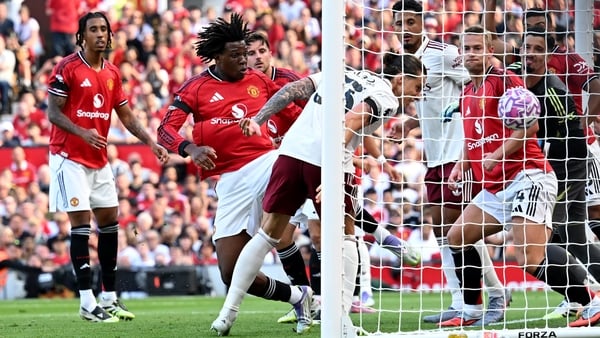 MANCHESTER, ENGLAND - AUGUST 17: Riccardo Calafiori of Arsenal scores his team's first goal past Altay Bayindir of Manchester United during the Premier League match between Manchester United and Arsenal at Old Trafford on August 17, 2025 in Manchester, En