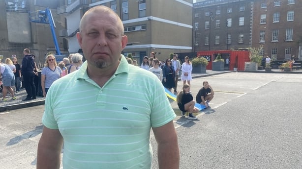 The CEO of the Ukrainian Crisis Centre in Ireland, Michael Baskin, stands on the street.