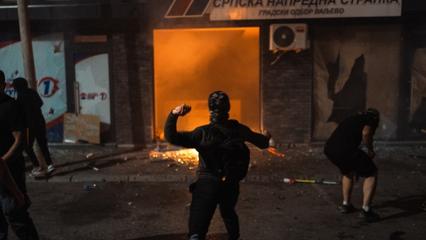 Protestors vandalise the Valjevo headquarters of the ruling Serbian Progressive Party.