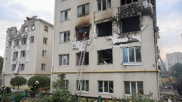 A building is seen with windows blown out and rooms heavily damaged following a drone attack