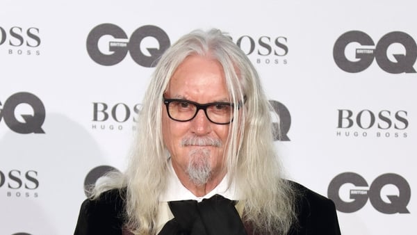 Comedian Billy Connolly posing for a picture
