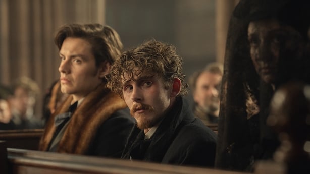 Louis Partridge (Edward Guinness) in church with Fionn O'Shea (Benjamin Guinness)