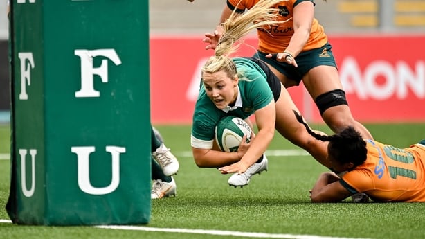 14 September 2024; Aoife Dalton of Ireland on the way to scoring her side's first try despite the tackle of Faitala Moleka of Australia during the Women's Rugby International match between Ireland and Australia at the Kingspan Stadium in Belfast. Photo by Oliver McVeigh/Sportsfile