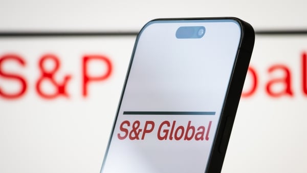 A mobile phone with the S&P global logo o it