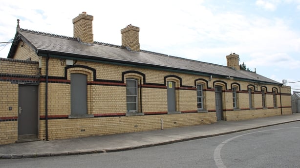 A photograph of the exterior of navan train station with boarded up windows