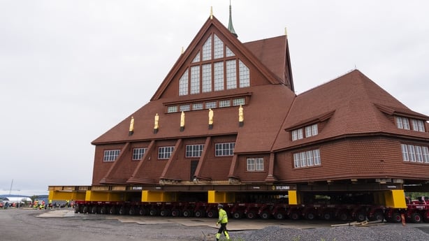 The church transport moves through an industrial area on in Kiruna, Sweden