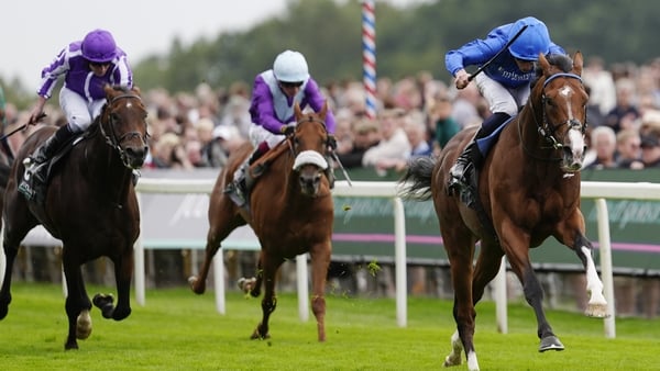 YORK, ENGLAND - AUGUST 20: William Buick riding Ombudsman (R, blue) win The Juddmonte International Stakes at York Racecourse on August 20, 2025 in York, England. (Photo by Alan Crowhurst/Getty Images)