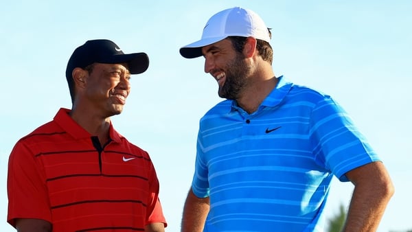 NASSAU, BAHAMAS - DECEMBER 03: Scottie Scheffler of the United States and tournament host Tiger Woods pose with the trophy after winning the final round of the Hero World Challenge at Albany Golf Course on December 03, 2023 in Nassau, . (Photo by Mike Ehr