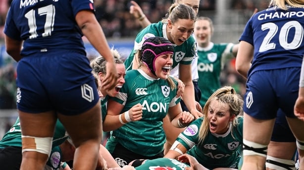 Ireland players, from left, Edel McMahon, Fiona Tuite, and Aoife Dalton celebrate their side's third try, scored by Aoife Wafer, not pictured, during the Women's Six Nations Rugby Championship match between Ireland and France