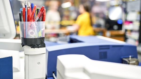 Stationery items placed in a makeshift container