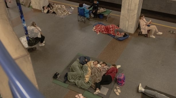 People lie on the floor of a metro station in Kyiv