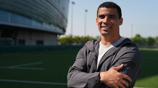 Rugby star Jordan Conroy poses with the Aviva Stadium in the background.