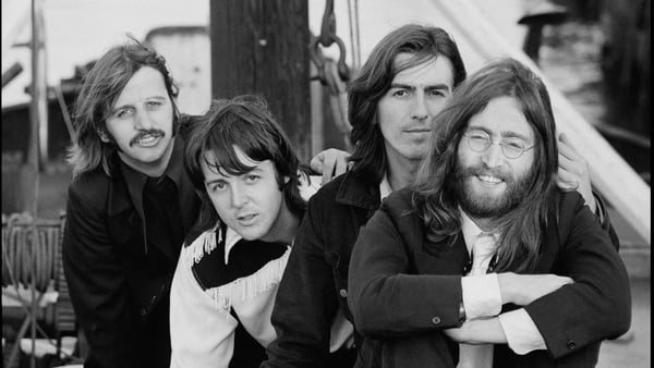 A photo of The Beatles smiling