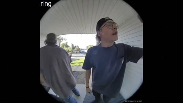 Footage shows teenagers breaking down the door of a burning house to rescue trapped dogs