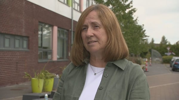 School secretary Cathy Foley speaking to RTÉ news outside a school