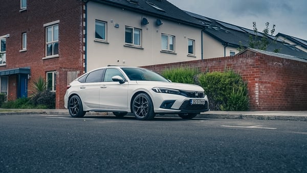 Civic hybrid parked in an urban housing estate