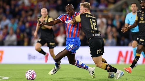 Jean-Philippe Mateta holds off Ulrik Fredriksen of Fredrikstad