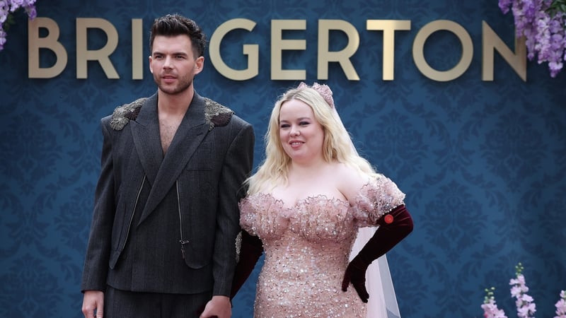 Luke Newton and Nicola Coughlan (pictured in London in June 2024) -
Their much-loved Bridgerton scene sees Coughlan's Penelope and Newton's Colin reach the fork in the road in their friendship