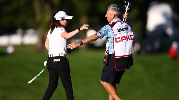 Leona Maguire and her caddie embrace on the 18th green after the first round of the 2025 CPKC Women's Open