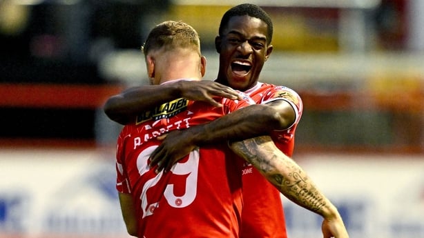 21 August 2025; Mipo Odubeko of Shelbourne, left, celebrates with teammate Paddy Barrett after scoring their side's second goal during the UEFA Conference League Play-off Round first leg match between Shelbourne and Linfield at Tolka Park in Dublin. Photo by Sam Barnes/Sportsfile
