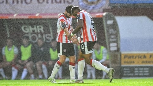 Dipo Akinyemi right, celebrates with team-mate Brandon Fleming after opening the scoring against Galway United