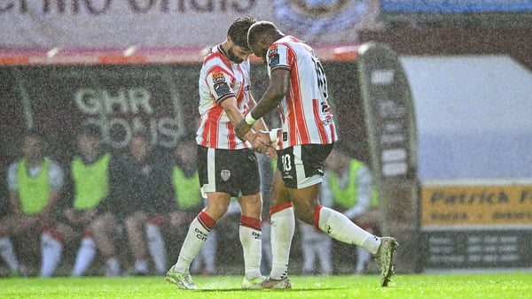 Dipo Akinyemi right, celebrates with team-mate Brandon Fleming after opening the scoring against Galway United