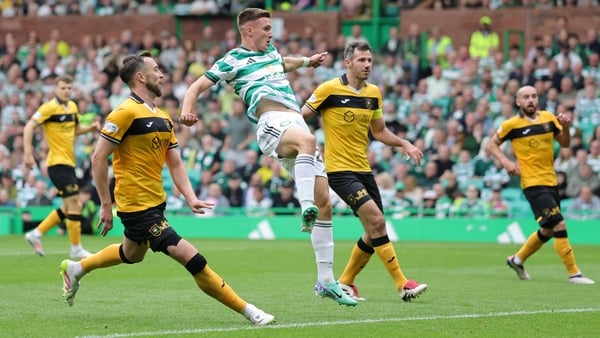 Celtic's Johnny Kenny (centre) scores his sides third goal against Livingston