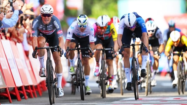 NOVARA, ITALY - AUGUST 23: (L-R) Stage winner Jasper Philipsen of Belgium and Team Alpecin - Deceuninck, Orluis Aular of Venezuela and Team Movistar and Ethan Vernon of Great Britain and Team Israel - Premier Tech sprint at finish line during the La Vuelt