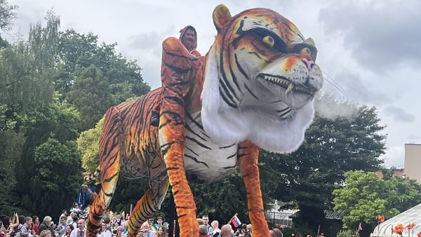 a parade float of a tiger is seen at a festival in Belfast