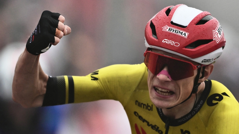 Jonas Vingegaard celebrates after crossing the finish line in Limone Piemonte,