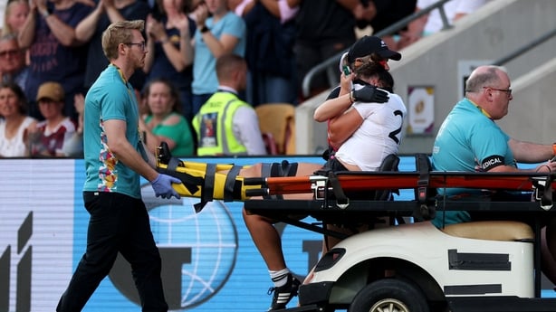 New Zealand's Kaipo Olsen-Baker reacts to an injury as she is driven off of the field during the Women's Rugby World Cup pool C match between New Zealand and Spain at York Community Stadium, York, northern England, on August 24, 2025. (Photo by Adrian Dennis / AFP)