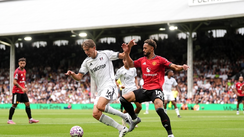 Sander Berge (left) and Manchester Matheus Cunha battle for possession