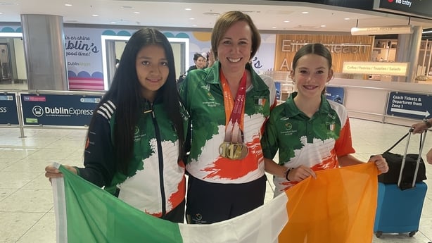 Isabelle O'Mahony and Mary Kate Desmond welcoming Mairead home from the games