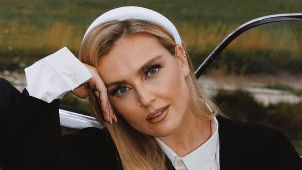 Perrie Edwards posing for a photo in a promotional photo