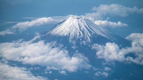 This picture shows Mount Fuji, Japan's highest mountain at 3,776 meters, seen from the window of a passenger aircraft en route to Kagoshima