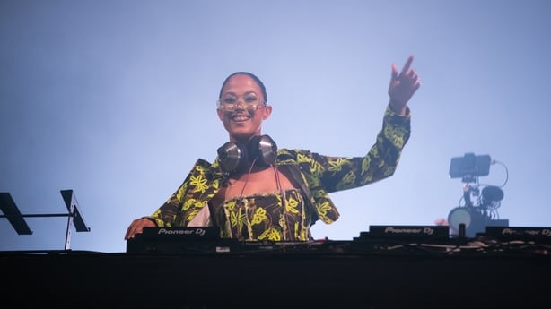 Jazzy holds her hand in the air as she plays at Electric Picnic 2023