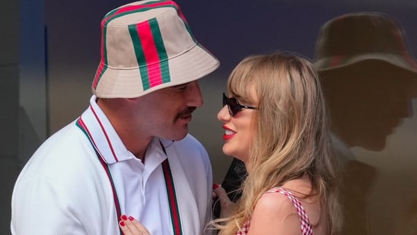 Travis Kelce and Taylor Swift embrace