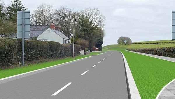 A road with grass on either side