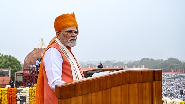A man stands on a podium
