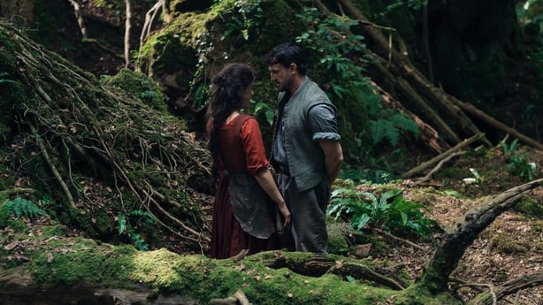 Jessie Buckley as Agnes and Paul Mescal as William Shakespeare in a woodland scene from director Chloé Zhao's Hamnet