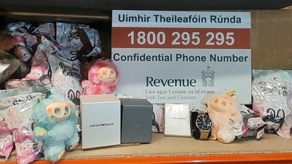 toys with a sign with revenue details displayed on a desk