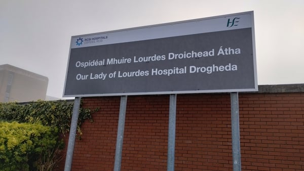 A sign which reads Our Lady of Lourdes Hospital Drogheda in English and Irish
