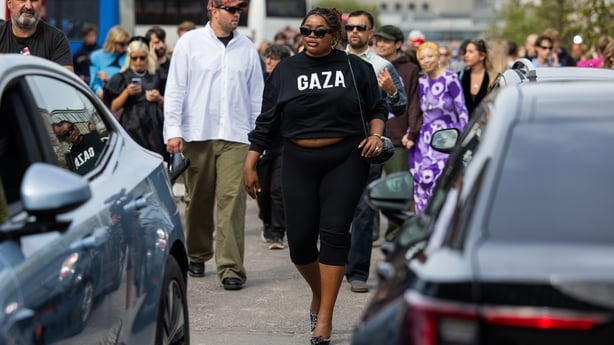 COPENHAGEN, DENMARK - AUGUST 07: Gabriella Karefa Johnson wears black tshirt with Gaza print, leggings outside Marimekko during Copenhagen Fashion Week day four on August 07, 2025 in Copenhagen, Denmark. (Photo by Christian Vierig/Getty Images)
