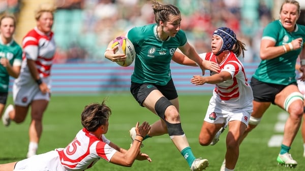 24 August 2025; Eve Higgins of Ireland is tackled by Japan players Sora Nishimura, left, and Moe Tsukui during the Women's Rugby World Cup 2025 Pool C match between Ireland and Japan at Franklin's Gardens in Northampton, England. Photo by Harry Murphy/Spo