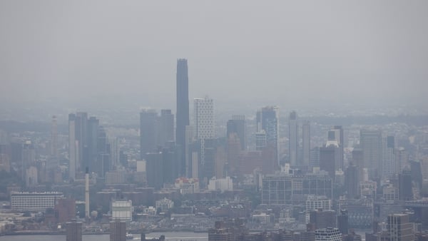 NEW YORK, NY - AUGUST 5: The view south to the skyline of Brooklyn and the Brooklyn Tower is shrouded by a thick layer of smoke from Canadian wildfires as seen from the 80th floor of the Empire State Building on August 5, 2025, in New York City. (Photo by