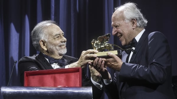 Francis Ford Coppola presents Werner Herzog with the Golden Lion for Lifetime Achievement during the opening ceremony of the 82nd Venice International Film Festival on 27 August, 2025 in Venice