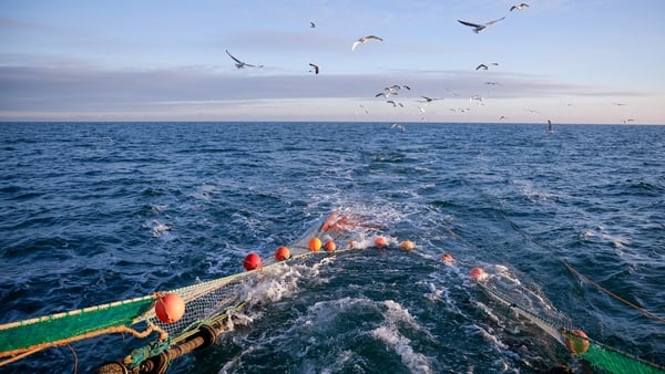 A fishing trawler and fishing nets at sea
