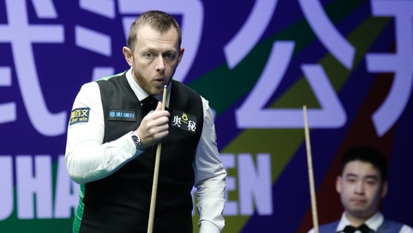 WUHAN, CHINA - AUGUST 28: Mark Allen of Northern Ireland chalks the cue in the Quarterfinal match against Si Jiahui of China on day 5 of the 2025 Wuhan Open at Optics Valley Gymnasium of HUST on August 28, 2025 in Wuhan, Hubei Province of China. (Photo by