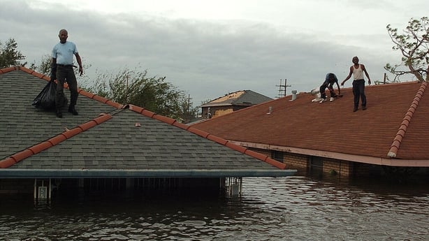 People stranded on the roofs waiting for a rescue boats